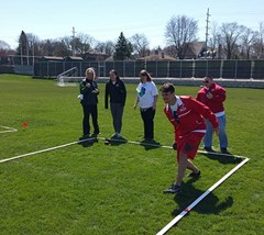 Carthage senior track & field athlete Kevin Plazak participates in the CCIW's bocce event with Special Olympics